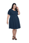 Curvy model facing camera wearing navy with white pin striped, knee length dress, featuring rounded neckline, fitted bodice, pleated A-line skirt and pockets. Kaitlyn available in sizes 6-26