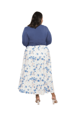 Curvy model facing the back wearing maxi dress with blue mid sleeved crossover top attached to white skirt with blue and tan watercolour accents. Mai available in sizes 6-26