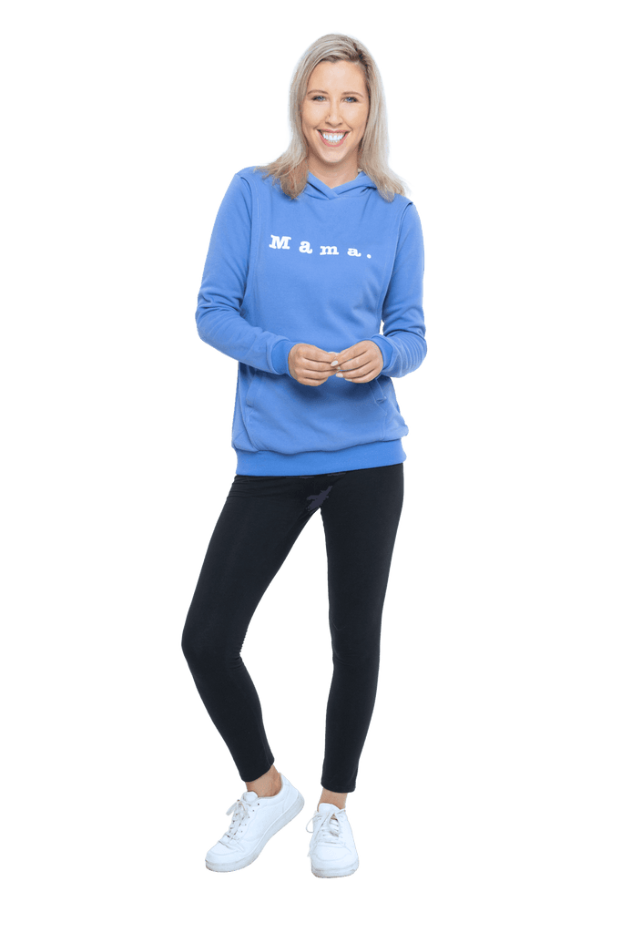 Petite model facing camera wearing cornflour blue hoodie, featuring front pocket, and white Mama print across the chest. Mama hoodie available in sizes 6-26