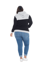 Curvy model facing the back wearing black hoodie with grey panel over chest, shoulders, and top of back, featuring front pocket, and grey highlights at pocket openings and sleeve cuffs. Olivia hoodie available in sizes 6-26