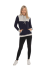 Petite model facing camera wearing navy hoodie with grey panel over chest, shoulders, and top of back, featuring front pocket, and grey highlights at pocket openings and sleeve cuffs. Olivia hoodie available in sizes 6-26