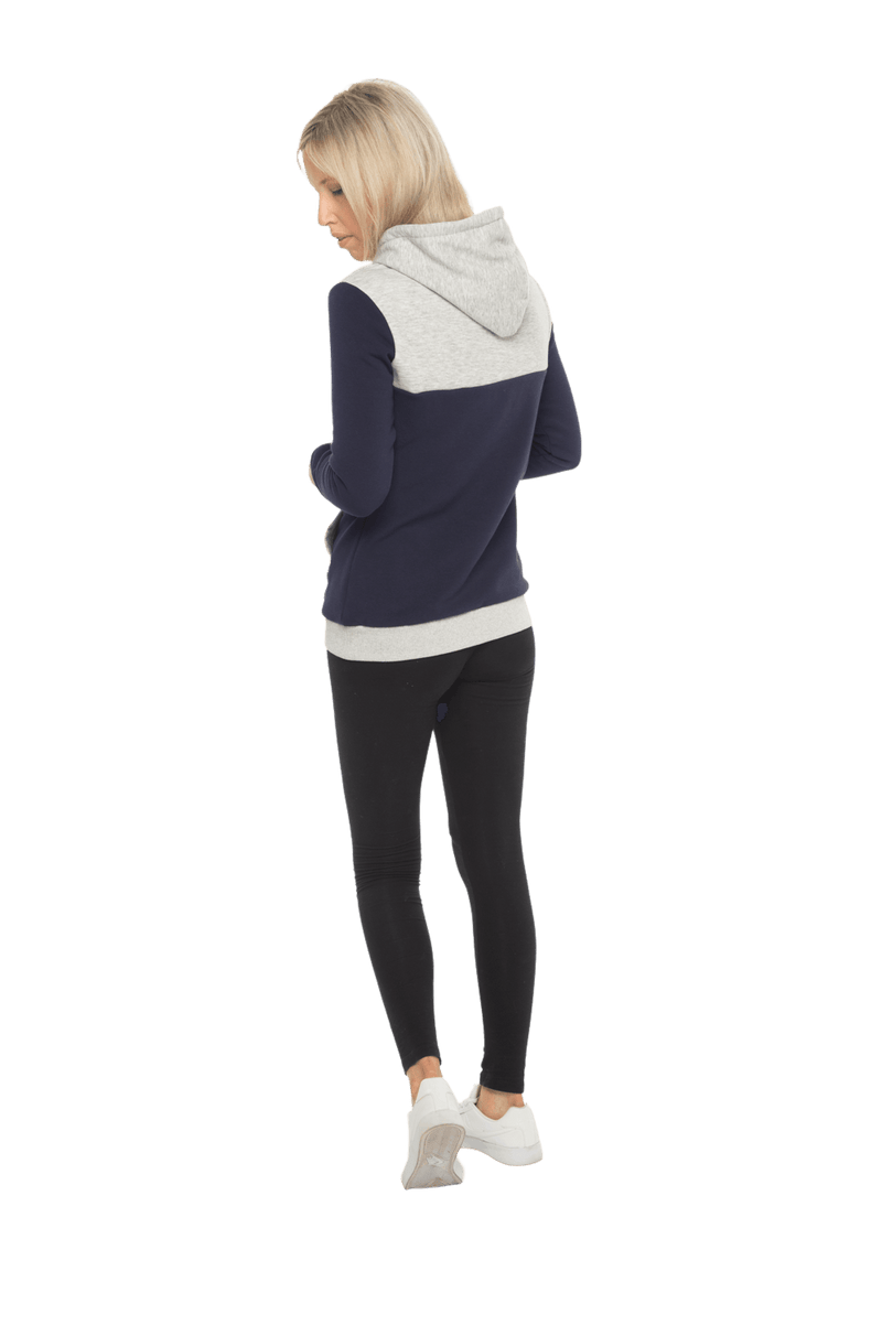 Petite model facing the back wearing navy hoodie with grey panel over chest, shoulders, and top of back, featuring front pocket, and grey highlights at pocket openings and sleeve cuffs. Olivia hoodie available in sizes 6-26