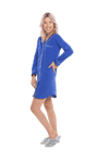 Petite model facing the side wearing royal blue button up, mid thigh length pyjama shirt, featuring fold over collar, scooped hemline, and white piping. Parker available in sizes 6-18
