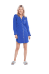 Petite model facing camera wearing royal blue button up, mid thigh length pyjama shirt, featuring fold over collar, scooped hemline, and white piping. Parker available in sizes 6-18