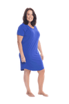 Brunette model facing the side wearing royal blue mid thigh length nightie, featuring rounded neckline, scooped hemline with short sleeves. Penny available in sizes 6-18
