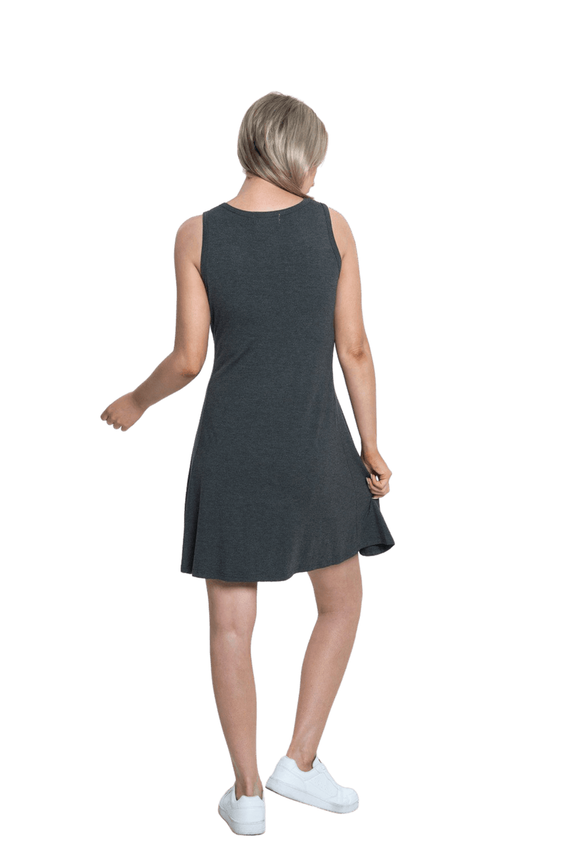 Petite model facing the back wearing charcoal grey mid thigh length dress, featuring rounded neckline, pockets and a waist sash tied at the front. Peyton available in sizes 6-26