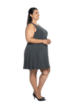 Curvy model facing the side wearing charcoal grey mid thigh length dress, featuring rounded neckline, pockets and a waist sash tied at the back. Peyton available in sizes 6-26