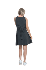 Petite model facing the back wearing charcoal grey mid thigh length dress, featuring rounded neckline, pockets and a waist sash tied at the back. Peyton available in sizes 6-26