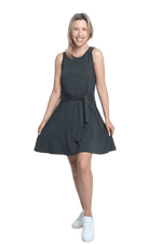 Petite model facing camera wearing charcoal grey mid thigh length dress, featuring rounded neckline, pockets and a waist sash tied at the front. Peyton available in sizes 6-26