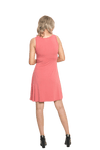 Petite model facing the back wearing dusty pink mid thigh length dress, featuring rounded neckline, pockets and a waist sash tied at the front. Peyton available in sizes 6-26
