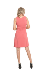 Petite model facing the back wearing dusty pink mid thigh length dress, featuring rounded neckline, pockets and a waist sash tied at the front. Peyton available in sizes 6-26