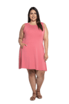 Curvy model facing camera wearing dusty pink mid thigh length dress, featuring rounded neckline, pockets and a waist sash tied at the back. Peyton available in sizes 6-26