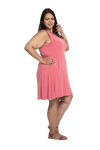 Curvy model facing the side wearing dusty pink mid thigh length dress, featuring rounded neckline, pockets and a waist sash tied at the back. Peyton available in sizes 6-26