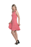 Petite model facing the side wearing dusty pink mid thigh length dress, featuring rounded neckline, pockets and a waist sash tied at the front. Peyton available in sizes 6-26