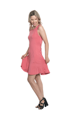 Petite model facing the side wearing dusty pink mid thigh length dress, featuring rounded neckline, pockets and a waist sash tied at the front. Peyton available in sizes 6-26