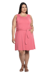 Curvy model facing camera wearing dusty pink mid thigh length dress, featuring rounded neckline, pockets and a waist sash tied at the front. Peyton available in sizes 6-26