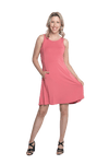 Petite model facing the camera wearing dusty pink mid thigh length dress, featuring rounded neckline, pockets and a waist sash tied at the back. Peyton available in sizes 6-26