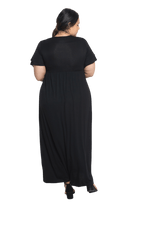 Curvy model facing the back wearing black maxi dress, featuring crossover V-neck, double layer detailed sleeves, pockets and a beautiful Grecian flowing silhouette. Phoebe available in sizes 6-26