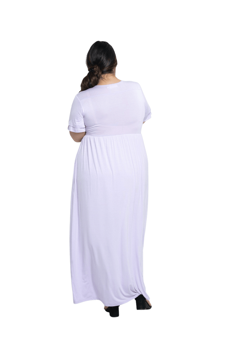 Curvy model facing the back wearing lilac maxi dress, featuring crossover V-neck, double layer detailed sleeves, pockets and a beautiful Grecian flowing silhouette. Phoebe available in sizes 6-26