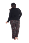 Curvy model facing the back wearing long sleeved pyjamas with pants. Top is black with contrast breast pocket matching pants. Pants are black with small red rose pattern, featuring pockets, and elasticated waist with pull tie. Piper available in sizes 6-26