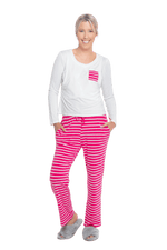 Petite model facing the camera wearing long sleeved pyjamas with pants. Top is white with contrast breast pocket matching pants. Pants are hot pink and white stripe, featuring pockets, and elasticated waist with pull tie. Piper available in sizes 6-18