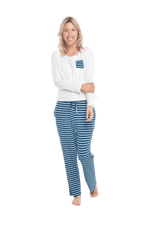 Petite model facing the camera wearing long sleeved pyjamas with pants. Top is white with contrast breast pocket matching pants. Pants are teal and white stripe, featuring pockets, and elasticated waist with pull tie. Piper available in sizes 6-18