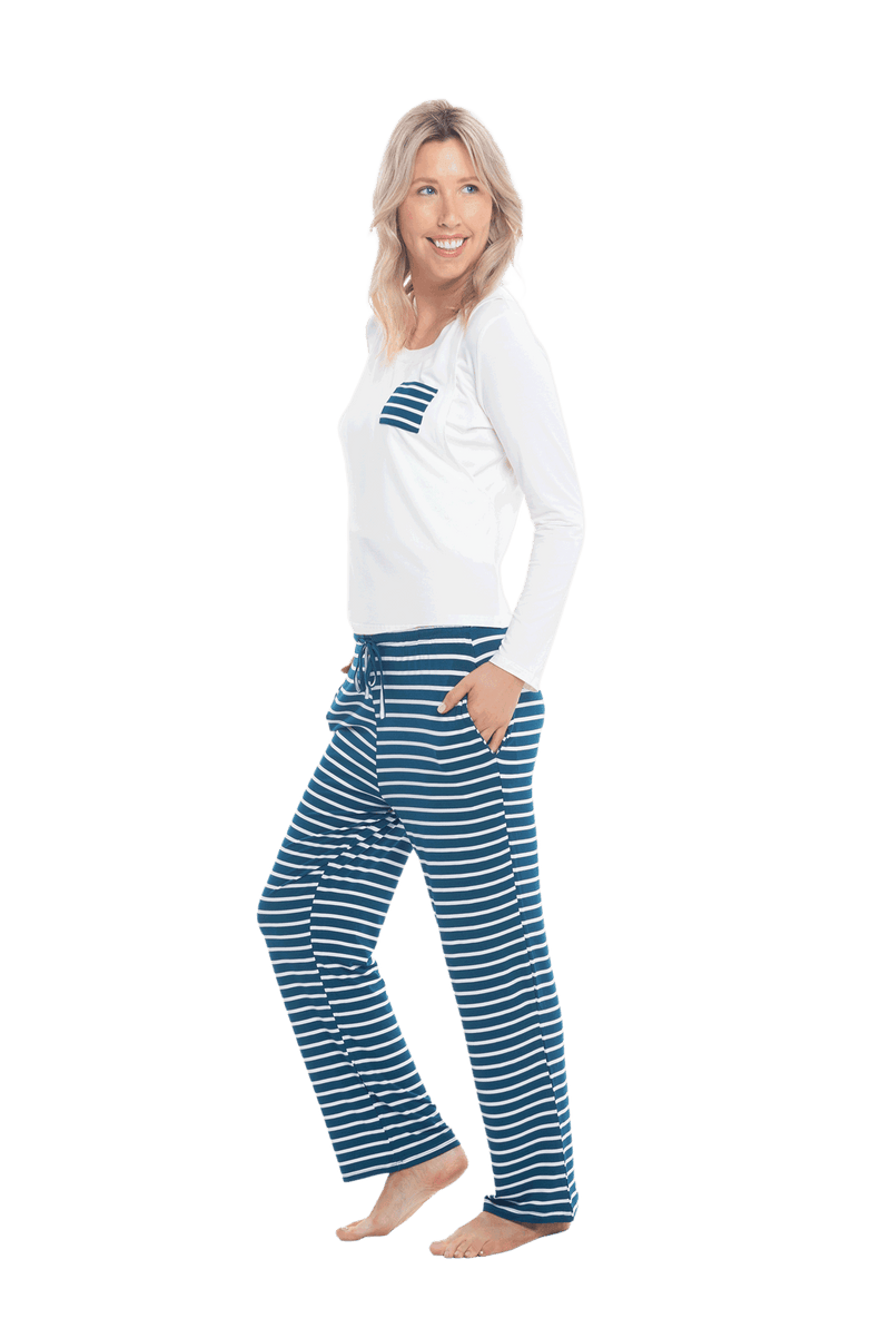 Petite model facing the side wearing long sleeved pyjamas with pants. Top is white with contrast breast pocket matching pants. Pants are teal and white stripe, featuring pockets, and elasticated waist with pull tie. Piper available in sizes 6-18