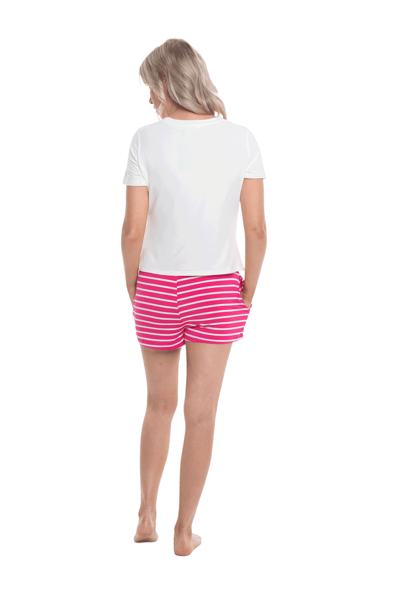 Petite model facing the back wearing long sleeved pyjamas with pants. Top is white with contrast breast pocket matching pants. Pants are hot pink and white stripe, featuring pockets, and elasticated waist with pull tie. Piper available in sizes 6-18