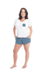 Brunette model facing the camera wearing short sleeved pyjamas with shorts. Top is white with contrast breast pocket matching shorts. Shorts are teal and white stripe, featuring pockets, and elasticated waist with pull tie. Poppy available in sizes 6-18