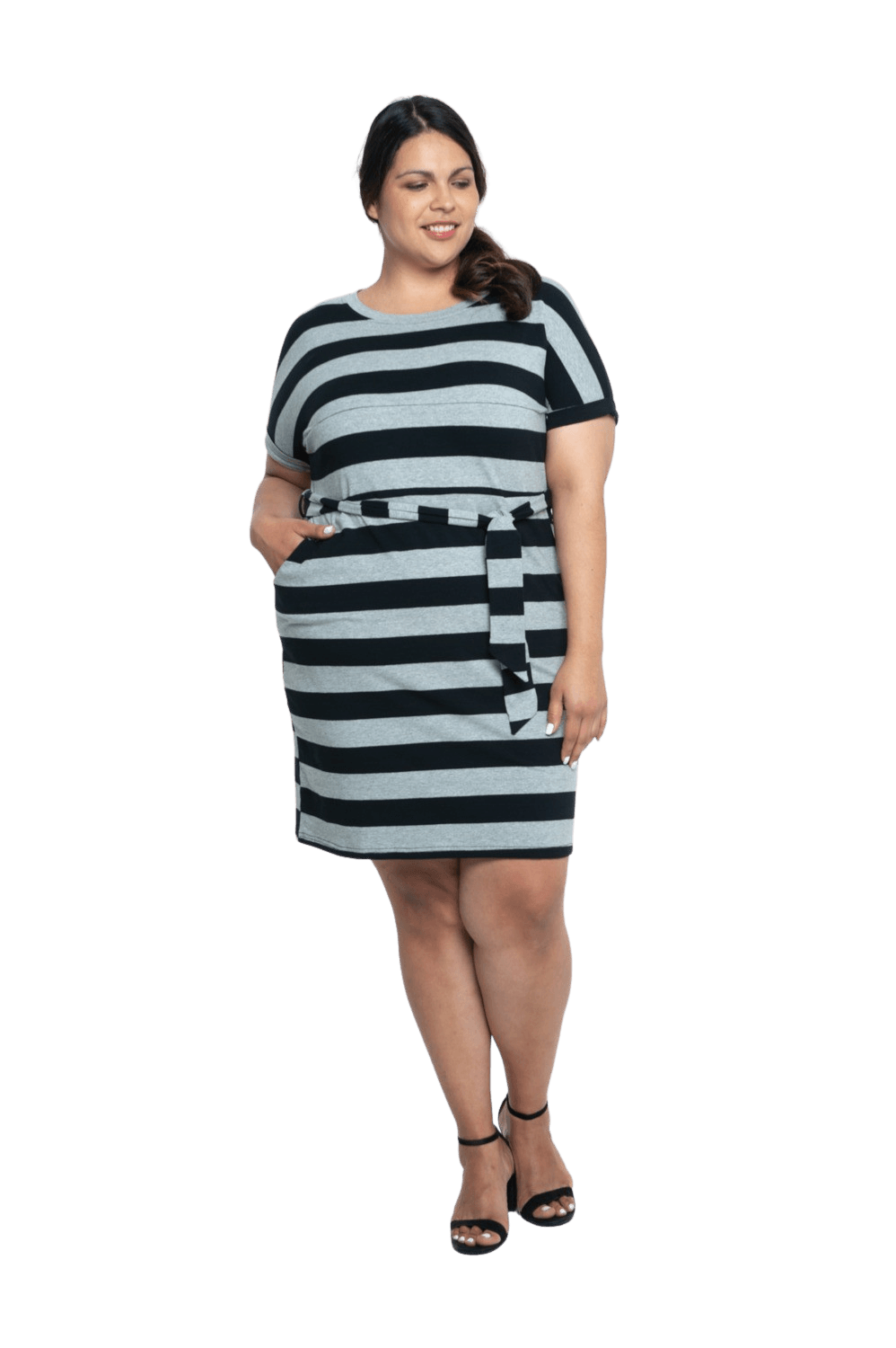 Curvy model facing camera wearing charcoal grey and black striped t-shirt dress, featuring rounded neckline, pockets, belt feature, and capped sleeves. Quinn available in sizes 6-26