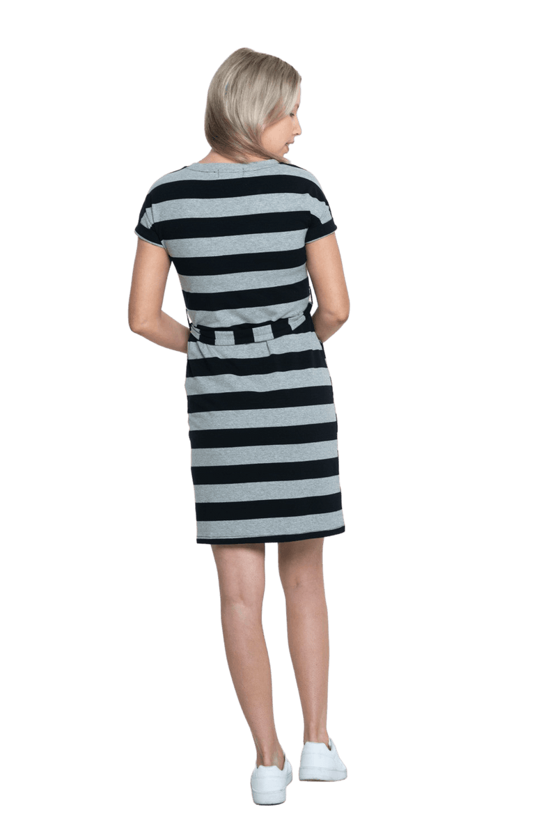 Petite model facing the back wearing charcoal grey and black striped t-shirt dress, featuring rounded neckline, pockets, belt feature, and capped sleeves. Quinn available in sizes 6-26