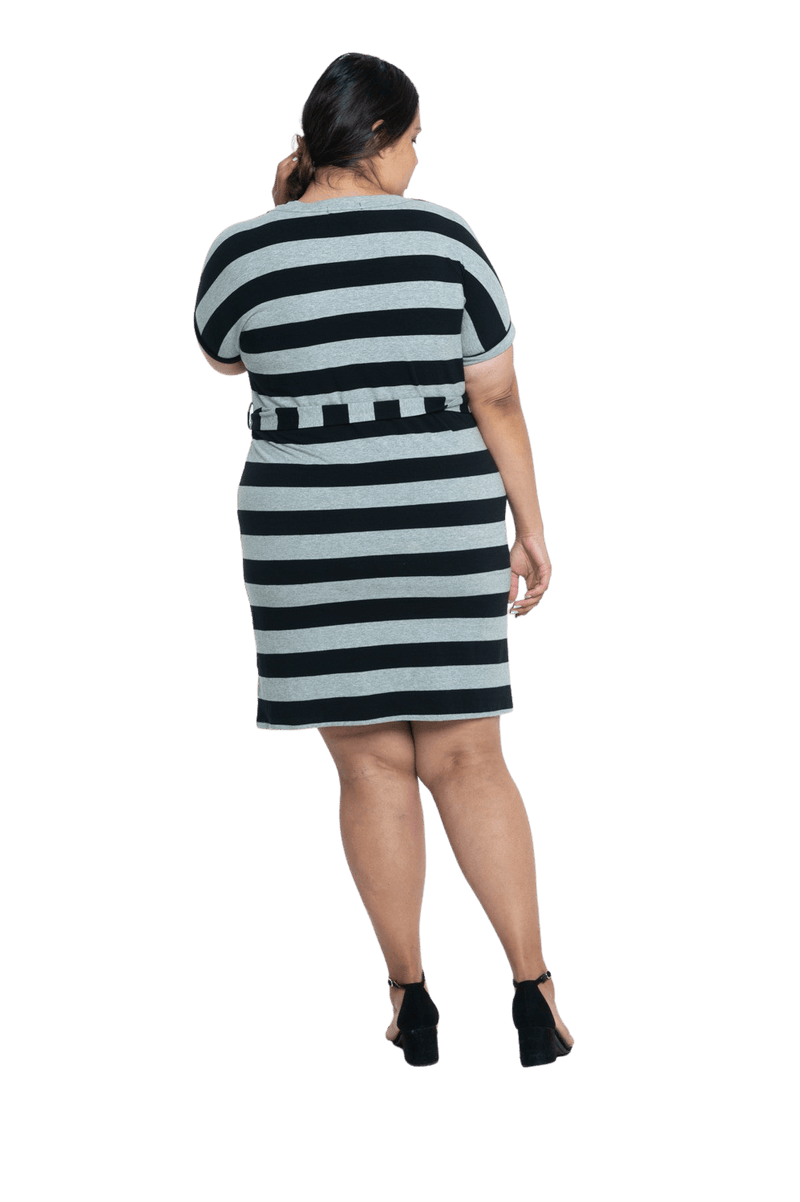 Curvy model facing the back wearing charcoal grey and black striped t-shirt dress, featuring rounded neckline, pockets, belt feature, and capped sleeves. Quinn available in sizes 6-26