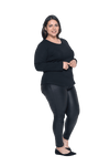 Curvy model facing the side wearing black long sleeved top, featuring soft V-neck and a scooped hem. Reese available in sizes 6-26