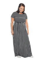 Brunette model facing camera wearing black and white striped maxi dress, featuring rounded neckline, and a gently fitted bodice, gathering above the waist. Riley available in sizes 6-18