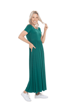 Petite model facing the side wearing bottle green maxi dress, featuring  rounded neckline, and a gently fitted bodice, gathering above the waist. Riley available in sizes 6-26