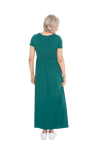 Petite model facing the back wearing bottle green maxi dress, featuring  rounded neckline, and a gently fitted bodice, gathering above the waist. Riley available in sizes 6-26