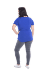 Petite model facing the back wearing cobalt blue short sleeved tee, featuring rounded neckline, and scooped hem. Stevie available in sizes 6-18