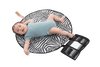 The All Rounder Change Mat shown laying flat with a baby lying on top. Baby has brown hair and wears blue short sleeves onesie. His tiny little toes and fingers are so cute!