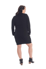 Brunette model facing the back wearing black long sleeved tunic, featuring pockets and a faux hoodie collar in a comfy, relaxed fit. Tori available in sizes 6-18