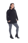 Brunette model facing the camera wearing black long sleeved tunic as a top with jeans, featuring pockets and a faux hoodie collar in a comfy, relaxed fit. Tori available in sizes 6-18