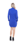 Petite model facing the back wearing cobalt blue long sleeved tunic as a dress with boots, featuring pockets and a faux hoodie collar in a comfy, relaxed fit. Tori available in sizes 6-18