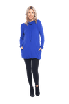 Petite model facing the camera wearing cobalt blue long sleeved tunic as a top with black pants, featuring pockets and a faux hoodie collar in a comfy, relaxed fit. Tori available in sizes 6-18