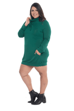 Curvy model facing the side wearing bottle green long sleeved tunic as a dress with boots, featuring pockets and a faux hoodie collar in a comfy, relaxed fit. Tori available in sizes 6-26