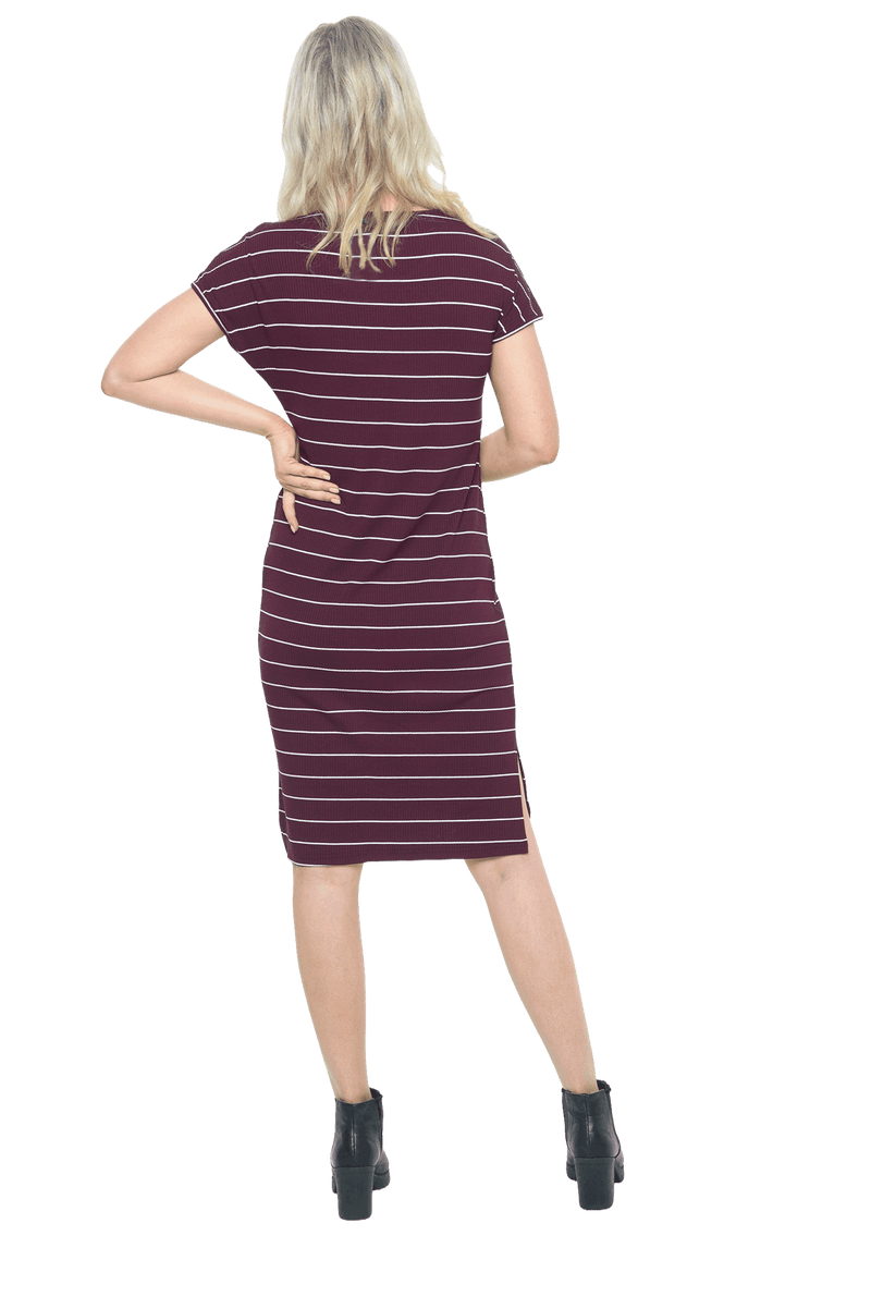 Petite model facing the back wearing maroon with white pin striped shift dress, featuring slight v neck and side splits. Zoe available in sizes 6-18