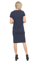 Petite model facing the back wearing navy with white pin striped shift dress, featuring slight v neck and side splits. Zoe available in sizes 6-18